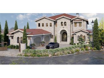 Elegant two-story home featuring a stone facade, red tile roof, and meticulously landscaped front yard at 8 Via Verona Ct, Henderson, NV 89011