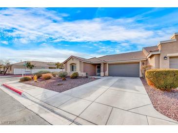 Charming single-story home featuring desert landscaping and an attached two-car garage at 8519 Little Fox St, Las Vegas, NV 89123