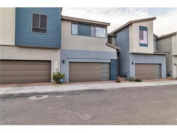 Modern townhouse featuring a two-car garage and contemporary design elements at 2699 Chance Canyon St, Henderson, NV 89044