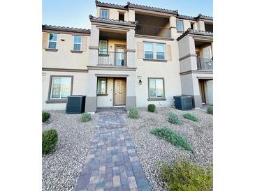 Inviting townhome showcasing desert landscaping and a private front balcony at 538 Ylang Pl, Henderson, NV 89015