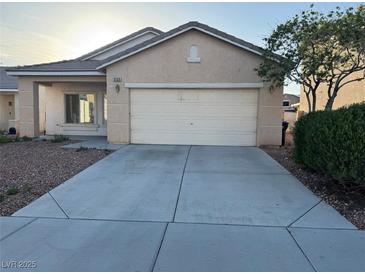 Charming single story home with attached two car garage and concrete driveway at 6165 Highland Gardens Dr, North Las Vegas, NV 89031