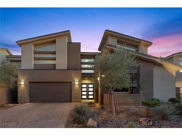 Contemporary two-story home with modern design, desert landscaping, and a two-car garage at 13 Scenic Terrain Ave, Henderson, NV 89011