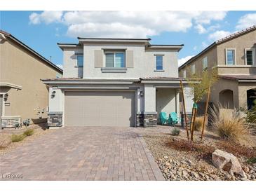 Charming two-story home featuring a brick driveway, desert landscaping, and a welcoming covered front porch at 6844 Bayou Hollow Ave, Las Vegas, NV 89156