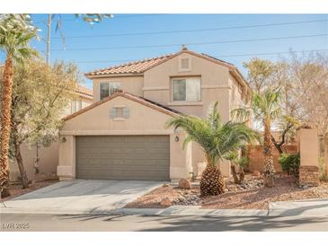 Charming two-story home features a well-maintained front yard and attached two-car garage at 9257 Harbor Stream Ave, Las Vegas, NV 89149