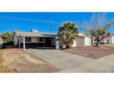 Charming single-story home with a large driveway and desert landscaping at 1500 Saylor Way, Las Vegas, NV 89108