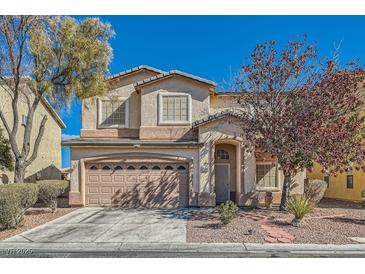 Charming two-story home with well-maintained landscaping and a two-car garage at 2724 Rosarito St, Las Vegas, NV 89108