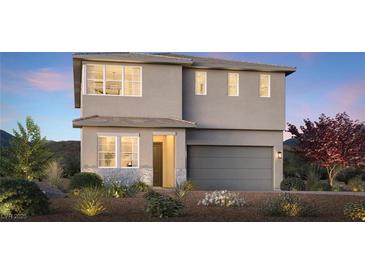 Charming two-story home featuring a gray stucco exterior, large windows, and an attached two-car garage at 7121 Serene Creek St, Las Vegas, NV 89131