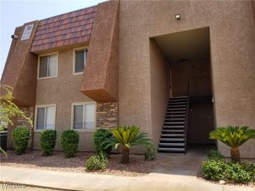 Exterior of a multi-unit building featuring a unique architectural design and manicured landscaping at 4965 Indian River Dr # 108, Las Vegas, NV 89103