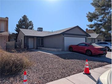 Charming single-story home with a well-maintained front yard and two-car garage, with nice desert landscaping at 5439 Pomeroy Cir, Las Vegas, NV 89142