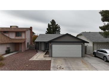 Charming one-story home features neutral paint, two-car garage and low maintenance front yard at 5439 Pomeroy Cir, Las Vegas, NV 89142