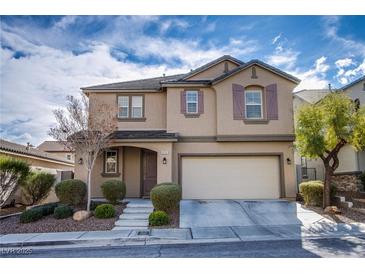 Charming two-story home with manicured front yard and attached two-car garage at 976 Baronet Dr, Las Vegas, NV 89138