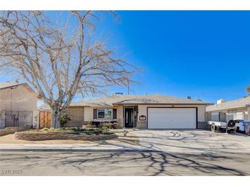 Charming single-story home featuring a well-kept front yard and a spacious two-car garage at 216 Candlelight St, Las Vegas, NV 89145