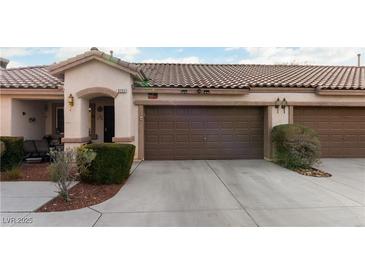 Charming single-story home with a two-car garage and well-maintained landscaping at 9293 Boltonia Ct, Las Vegas, NV 89149