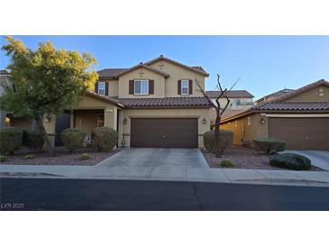 Charming two-story home featuring a well-manicured front yard and inviting curb appeal at 933 Monte Nerone Ave, Henderson, NV 89012