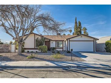 Charming single-story home with a well-maintained front yard and attached two-car garage at 3665 Bronco Rd, Las Vegas, NV 89103