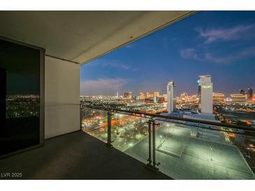 Enjoy spectacular Las Vegas Strip views from this luxury condo balcony with glass railings and city lights at 4381 W Flamingo Rd # 2322/2320, Las Vegas, NV 89103