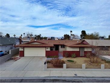 Charming single-story home featuring a two-car garage and well-kept front yard at 6216 Bullion Blvd, Las Vegas, NV 89103