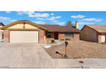 Charming single-story home featuring a two car garage and low maintenance landscaping at 6408 Starcrest Dr, Las Vegas, NV 89108