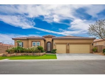 Beautiful single-story home with desert landscaping, a tile roof, and an attached two-car garage at 7231 Adobe Hills Ave, Las Vegas, NV 89113