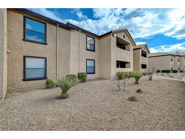 Tan stucco building with well maintained desert landscaping at 2451 N Rainbow Blvd # 1150, Las Vegas, NV 89108