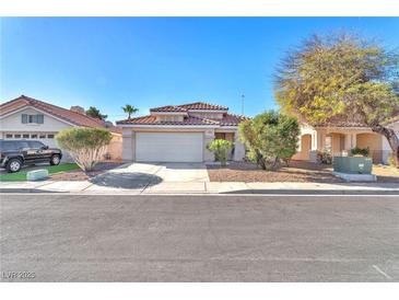 Charming single-story home with a well-maintained front yard, two-car garage, and a tile roof at 2459 Avenida Cataluna, Henderson, NV 89074