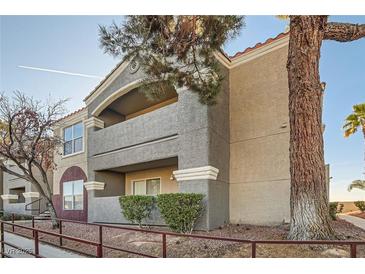 Attractive condo building showcasing an exterior view with balconies and well-maintained landscaping at 5055 W Hacienda Ave # 1116, Las Vegas, NV 89118