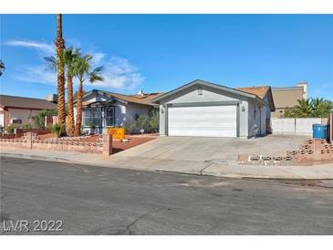 Charming single-story home with a two car garage and low maintenance desert landscaping at 5816 W Cherokee Ave, Las Vegas, NV 89103