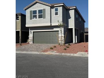 Charming two-story home featuring a well-maintained yard and attached two-car garage at 6616 Bowery St, Las Vegas, NV 89148