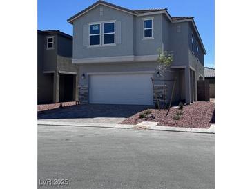 Charming two-story home featuring a two-car garage and a well-maintained front yard at 6616 Bowery St, Las Vegas, NV 89148