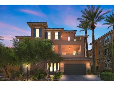 Inviting two-story home boasts a charming facade, mature landscaping, and a convenient two-car garage at 75 Luce Del Sole # 3, Henderson, NV 89011