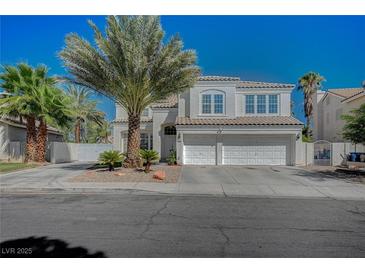 Charming two-story home featuring desert landscaping and a three-car garage at 7650 Hartwell Dr, Las Vegas, NV 89123