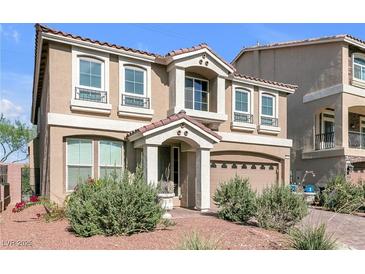 Charming two-story home with a well-manicured lawn and a welcoming entrance at 8573 Silver Coast St, Las Vegas, NV 89139