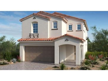 Charming two-story stucco home featuring a tile roof, arched entryway, and two-car garage at 89 Tardando Ave, Henderson, NV 89011