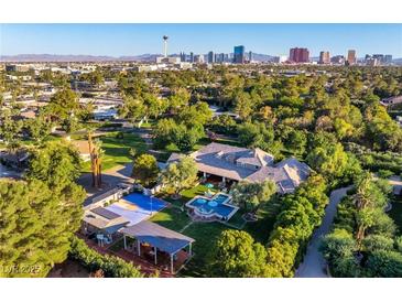 Expansive estate boasts a pool, garden, and cabana, all with Las Vegas city views at 330 Rancho Cir, Las Vegas, NV 89107