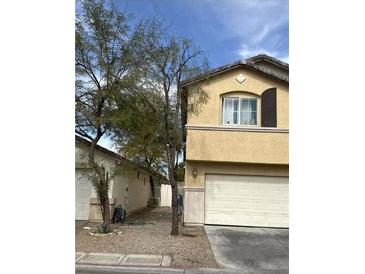 Two story home with an attached two car garage and simple landscaping at 4356 Pittsfield St, Las Vegas, NV 89115