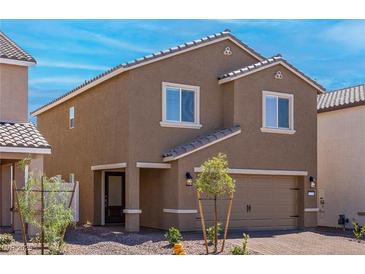 Charming two-story home with a well-manicured front yard and inviting curb appeal on a sunny day at 6257 Blood Lily Ave, Las Vegas, NV 89122