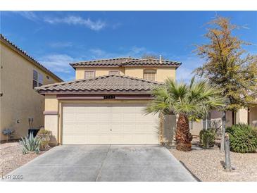Charming two-story home with a tile roof, well-manicured lawn, and a two-car garage at 4068 Pistachio Nut Ave, Las Vegas, NV 89115