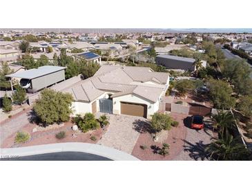 Stunning single-story home with tile roof, desert landscaping, RV parking and decorative wrought iron gate at 8604 Amber Autumn St, Las Vegas, NV 89131