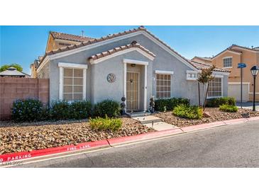 Charming single-story home with neutral color palette, desert landscaping, and covered entry at 2510 Influential Ct, North Las Vegas, NV 89031