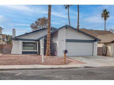 Charming single-story home featuring desert landscaping, an attached garage and a serene street view at 4775 Monaco Rd, Las Vegas, NV 89121