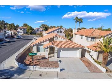 Charming single-Gathering home with two-car garage and well-maintained desert landscaping at 2045 Summit Pointe Dr, Las Vegas, NV 89117