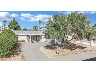 Charming single-story home with a well-manicured yard and a welcoming entrance at 3800 San Joaquin Ave, Las Vegas, NV 89102