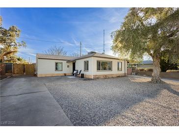 Charming single-story home featuring a well-maintained gravel front yard and a quaint patio area at 478 S Water St, Henderson, NV 89015