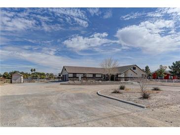 Charming single story home with circular driveway and exterior shed at 6917 Leon Ave, Las Vegas, NV 89131