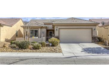 Charming single-story home with a two-car garage and low maintenance desert landscaping at 7828 Homing Pigeon St, North Las Vegas, NV 89084