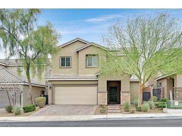 Charming two-story home featuring a well-manicured front yard and attached two-car garage at 376 Shanon Springs St, Henderson, NV 89014