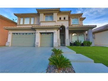Beautiful two-story home featuring a three-car garage and well-manicured landscaping at 4712 Stavanger Ln, Las Vegas, NV 89147