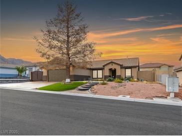 Charming single-story home with desert landscaping and a covered entryway at 6627 Bristle Canyon Ave, Las Vegas, NV 89110