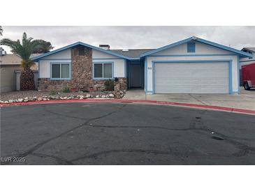 Charming single-story home with a stone accent wall and a two-car garage at 4712 Primavera St, Las Vegas, NV 89122