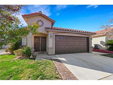Charming single-Gathering home featuring a well-maintained front yard and a two-car garage at 8427 Green Mesa Ct, Las Vegas, NV 89147